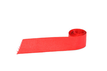 Rolled red ribbon on a white background