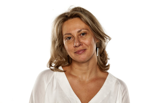 Portrait of beautiful and smiling middle-aged woman with no makeup