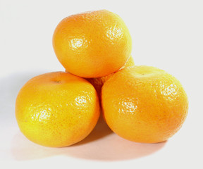 heap of ripe vivid color oranges isolated on white background, close-up