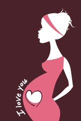 Silhouette of pregnant woman touching her belly