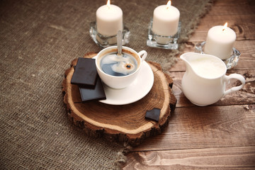 cup of hot coffee on a wooden tray