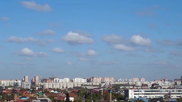 Clouds in the blue sky above the city. Timelapse.