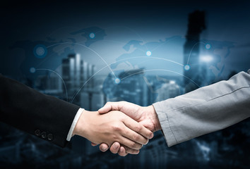 Handshake with map of the world in background