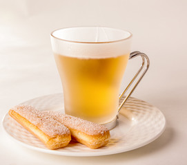 Sponge biscuits and beer on plate