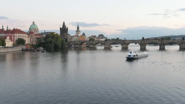 HD timelapse of a bridge with a boats floating down the river.