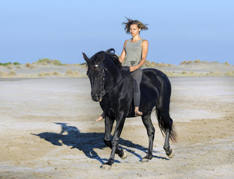 horsewoman on the beach