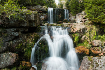 Fototapeta na wymiar Waterfall on Jedlova creek in Jizera mountains
