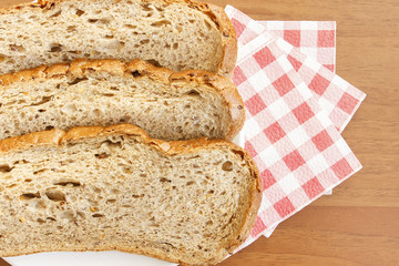 Black bread on table with red napkins