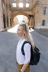 Fototapeta premium Pretty young woman traveler enjoying her travel in Europe