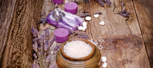 Fototapeta na wymiar Lavender soap, scented salt and spa stones - spa concept