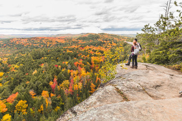 Couple looking at panorama from the top of the rocks