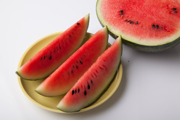 Fototapeta na wymiar Cut watermelon on dish ready to eat