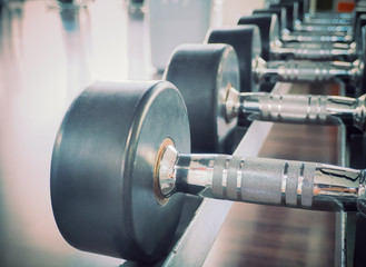Fototapeta premium Dumbbell in at the gym room /Color filter and selective focus