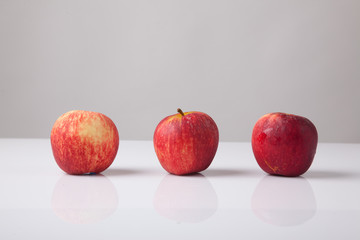 Three red apples