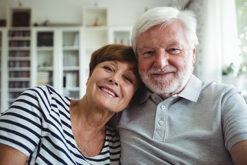 Senior couple sitting on sofa