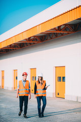 Architects on meeting. Walking and talking on construction site