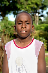 portrait of a boy in the caribbean sunshine - 124886024