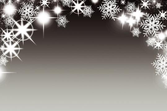 Christmas background with luminous garland with stars snowflakes and place for text. Sparkly holiday background with copy space. Black and gold background