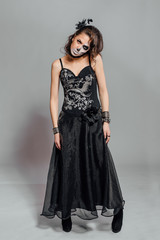 Fototapeta premium Portrait of young woman with skull make-up.