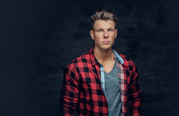 Portrait of positive stylish male in a red shirt.