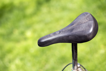 Old retro black bicycle saddle