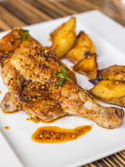 Grilled chicken and potato with spicy sauce