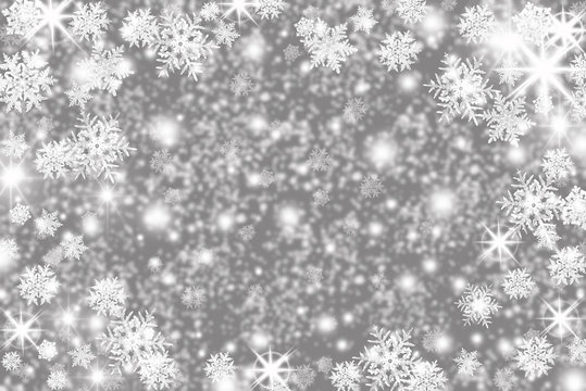 Christmas background with snowflakes, stars and place for text. Sparkly holiday background with copy space. Gray and silver background