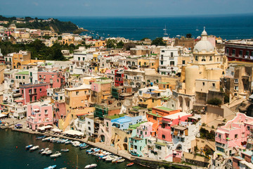 Fototapeta na wymiar The charming port of Corricella with its colorful fishermen houses, island of Procida, Naples, Italy