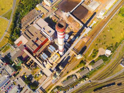 Aerial view of modern combined heat and power plant. Big chimney with sulphur removal unit. Heavy industry from above. Power and fuel generation in Czech Republic, European Union 