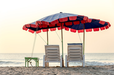 summer vacation, tourism, travel, holidays and people concept, folding chair on beach