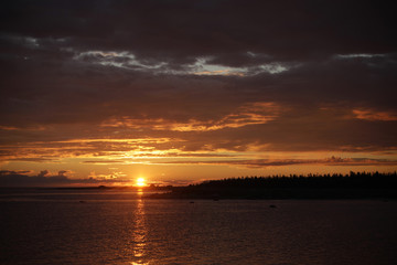 Orange-gold sunset over the islands