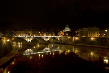 Fototapeta na wymiar tiber river by night in Rome with the reflection of the city