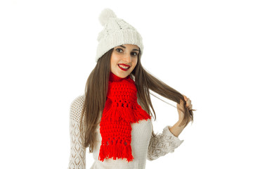 brunette girl in warm sweater and red scarf