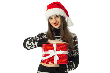 cheerful girl in warm sweater and santa hat