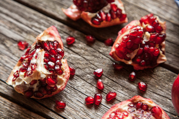 Fototapeta na wymiar Pomegranates on wooden table