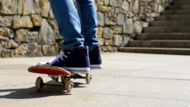Close up detail view of a skater feet riding his skate board, sport and recreation lifestyle