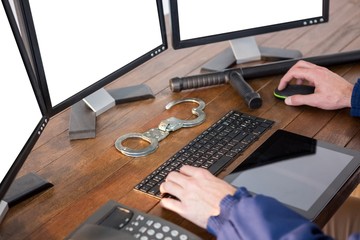 Hands of security officer using computer