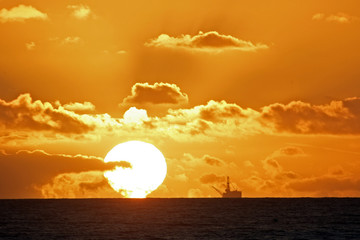 oil rig n ocean sunset