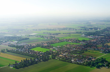 Obraz premium Aerial view of village at foggy morning.
