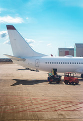 Passenger plane in the airport. Aircraft maintenance.