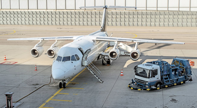 Commercial passenger plane in the airport. Aircraft maintenance.