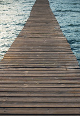 Old wooden pier leading to the sea.