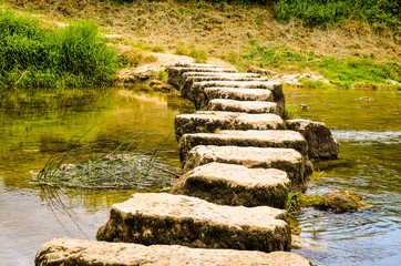 stepping stones crossing a small river