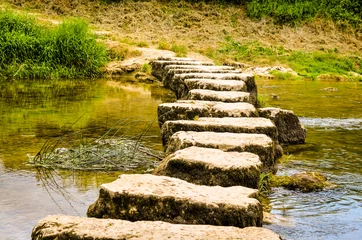 Foto op Canvas stepping stones crossing a small river © busenlilly666