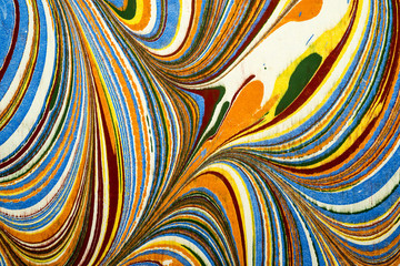 Ebru art. Traditional Turkish Ebru technique. Painting on water, followed by paper prints. Color paint ebru with waves and tile pattern.