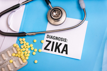 Zika virus word written on medical blue folder