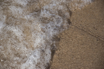 sea water closeup sand and wave background