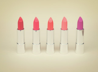 Collection of puple, pink and red shiny lipsticks