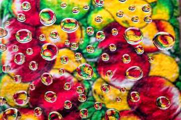 Water drops on colorful floral motif