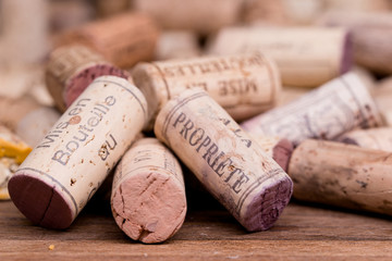close up of french wine cork on vintage oak wooden table